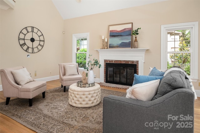 15535 Eagleview Dr, Charlotte, NC 28278 - living room with wood finished floors, a fireplace, vaulted ceiling, and baseboards