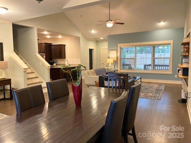 29 Woodbridge Park Dr, Asheville, NC 28803 - dining room with dark wood-style flooring, ceiling fan, vaulted ceiling, recessed lighting, and stairway