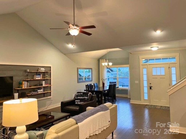 29 Woodbridge Park Dr, Asheville, NC 28803 - living room with baseboards, wood finished floors, a chandelier, a ceiling fan, and vaulted ceiling
