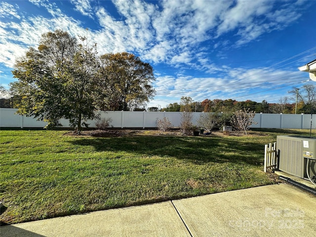 view of yard featuring cooling unit and a fenced backyard