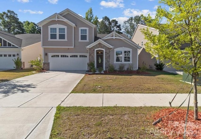 5024 Colline Ct, Charlotte, NC 28216 - view of front of property with stone siding, a garage, concrete driveway, and a front yard