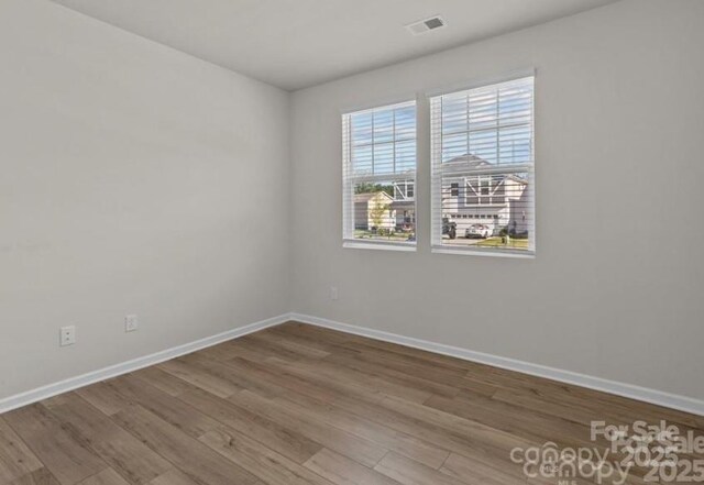 5024 Colline Ct, Charlotte, NC 28216 - spare room with wood finished floors and baseboards