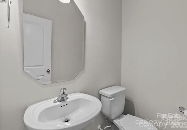 5024 Colline Ct, Charlotte, NC 28216 - half bath with a sink and toilet