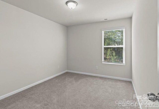 5024 Colline Ct, Charlotte, NC 28216 - carpeted spare room with baseboards
