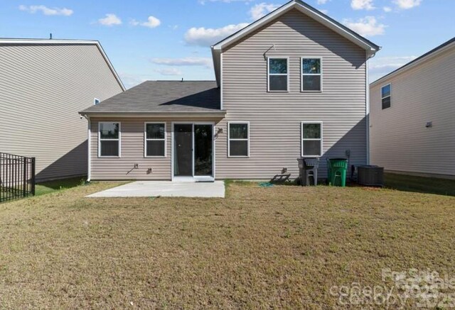 5024 Colline Ct, Charlotte, NC 28216 - back of property featuring a patio, a lawn, central AC, and roof with shingles