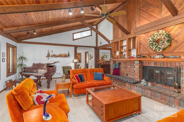 22 Waynewood Dr, Waynesville, NC 28786 - living room with wood ceiling, light wood-style flooring, beamed ceiling, a brick fireplace, and track lighting