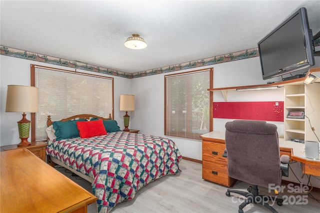 22 Waynewood Dr, Waynesville, NC 28786 - bedroom with light wood finished floors and baseboards