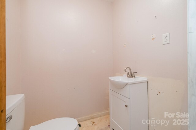 half bath with toilet and vanity