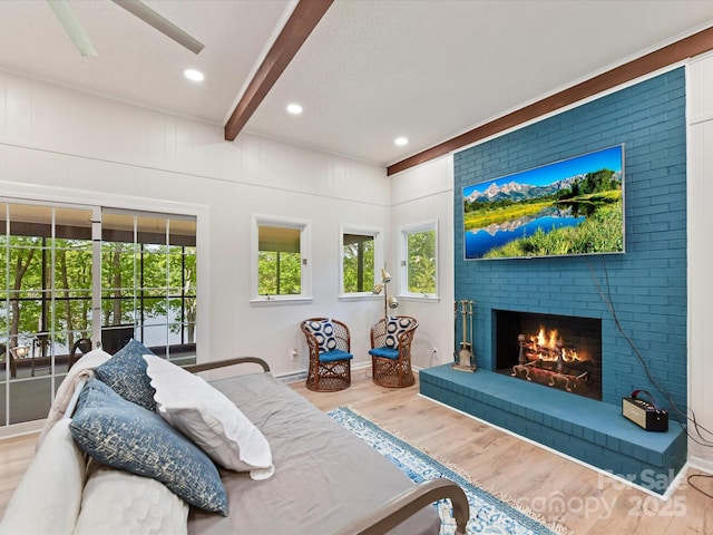 1278 Island Creek Dr, Troy, NC 27371 - living area with recessed lighting, wood finished floors, a ceiling fan, beamed ceiling, and a fireplace