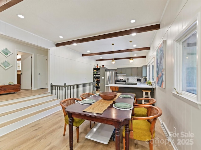 1278 Island Creek Dr, Troy, NC 27371 - dining space featuring light wood-type flooring, beamed ceiling, and crown molding