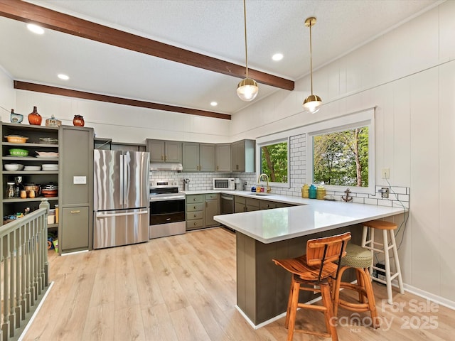 1278 Island Creek Dr, Troy, NC 27371 - kitchen with a sink, gray cabinets, stainless steel appliances, light wood-style flooring, and a peninsula