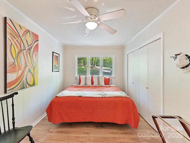 1278 Island Creek Dr, Troy, NC 27371 - bedroom featuring light wood-style flooring, a closet, and crown molding