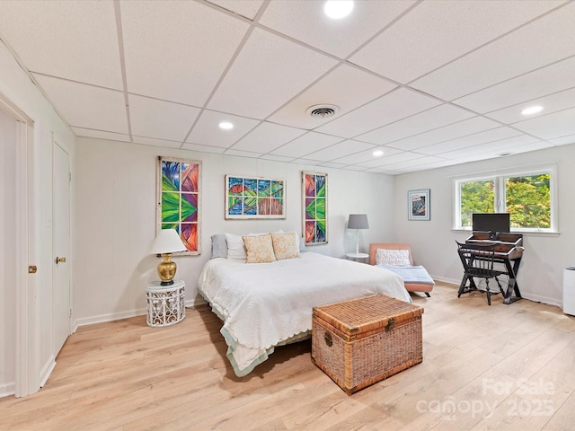 1278 Island Creek Dr, Troy, NC 27371 - bedroom featuring light wood-style floors, visible vents, a drop ceiling, and baseboards