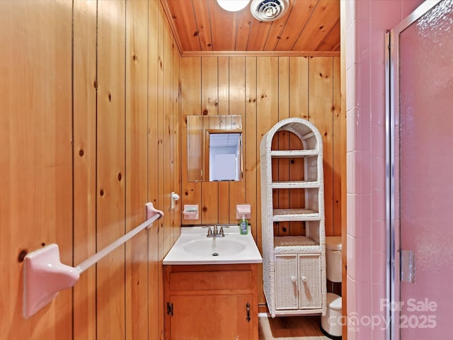 1278 Island Creek Dr, Troy, NC 27371 - bathroom with a shower stall, wood walls, wooden ceiling, toilet, and visible vents