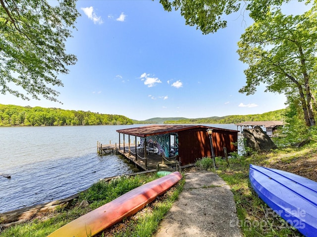 1278 Island Creek Dr, Troy, NC 27371 - view of dock featuring a wooded view and a water view