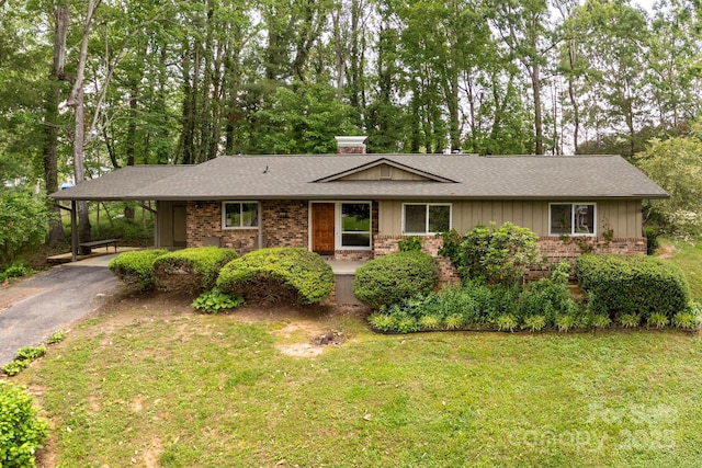 6 N Hudson Ln, Fletcher, NC 28732 - ranch-style home featuring brick siding, driveway, roof with shingles, and a chimney