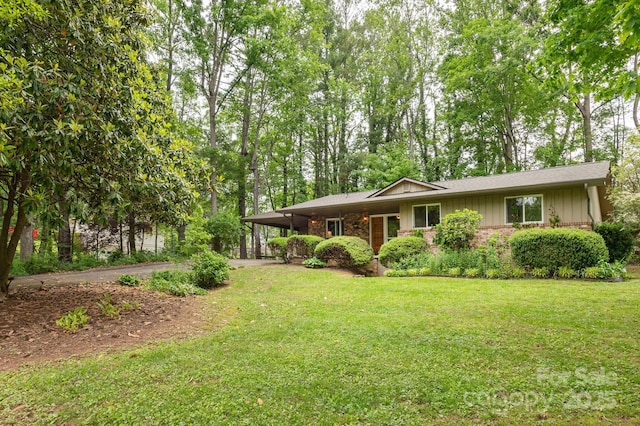 6 N Hudson Ln, Fletcher, NC 28732 - view of front of house with driveway, a front lawn, an attached carport, and brick siding
