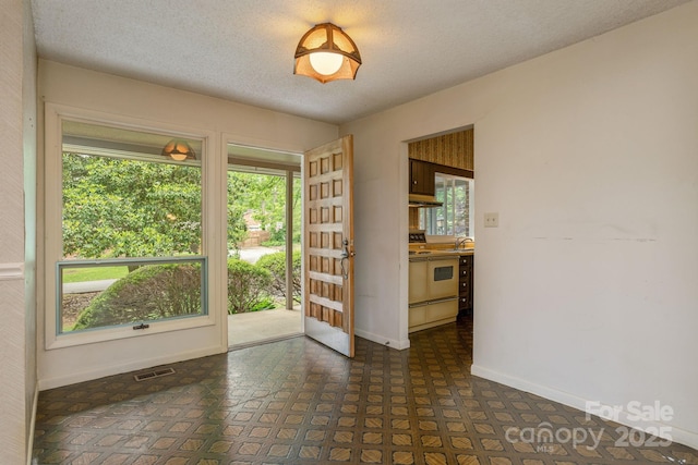 6 N Hudson Ln, Fletcher, NC 28732 - unfurnished room featuring baseboards and a textured ceiling