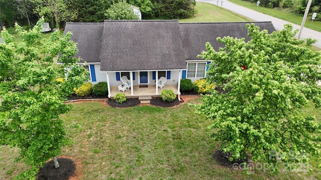 3124 Banks St, Lincolnton, NC 28092 - view of front of home with a front yard, a shingled roof, and covered porch