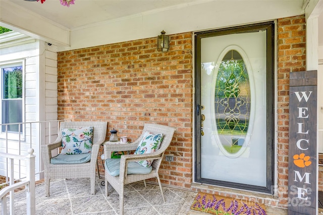 entrance to property with brick siding