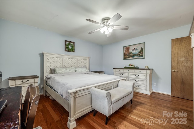 bedroom with ceiling fan, baseboards, and dark wood-style flooring