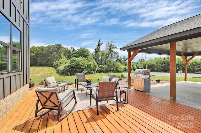 deck featuring area for grilling, a yard, and a patio area