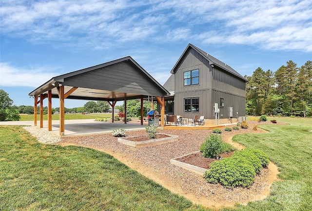 view of home's community featuring a lawn and a patio