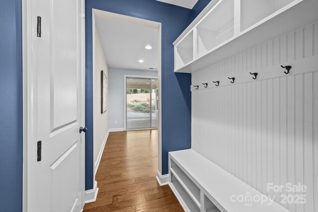 mudroom featuring baseboards, recessed lighting, and dark wood-style flooring