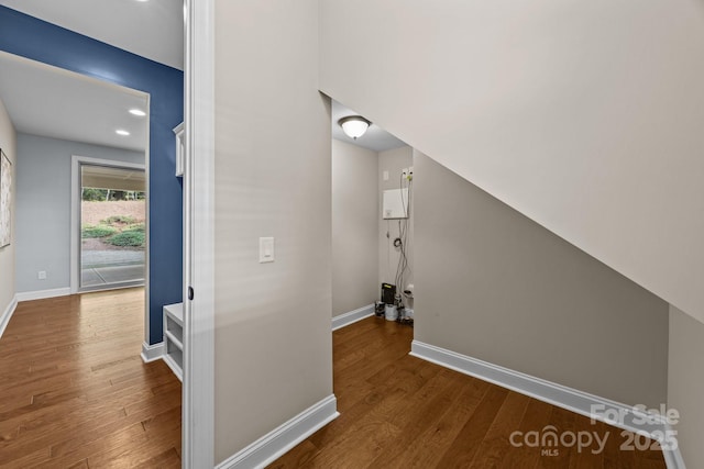 interior space with recessed lighting, wood finished floors, and baseboards