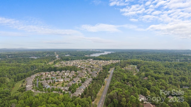 bird's eye view with a residential view and a view of trees