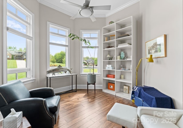 767 Pinnacle Dr, Iron Station, NC 28080 - sitting room with crown molding, a ceiling fan, baseboards, and hardwood / wood-style floors