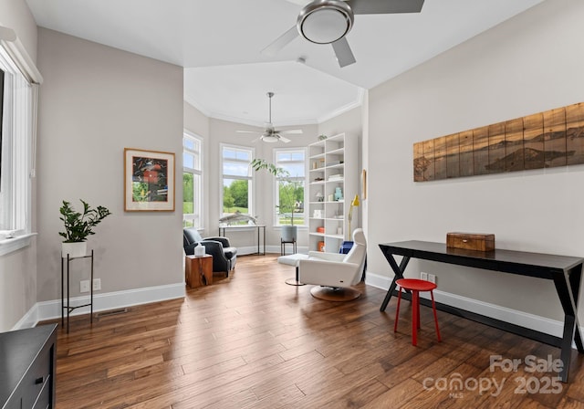 767 Pinnacle Dr, Iron Station, NC 28080 - sitting room featuring baseboards, a ceiling fan, crown molding, and wood finished floors