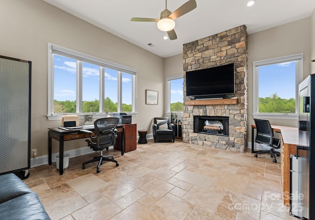 767 Pinnacle Dr, Iron Station, NC 28080 - office featuring stone tile flooring, a ceiling fan, baseboards, and a fireplace
