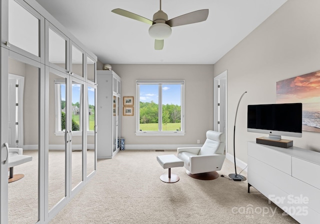 767 Pinnacle Dr, Iron Station, NC 28080 - living area featuring baseboards, a ceiling fan, and light carpet