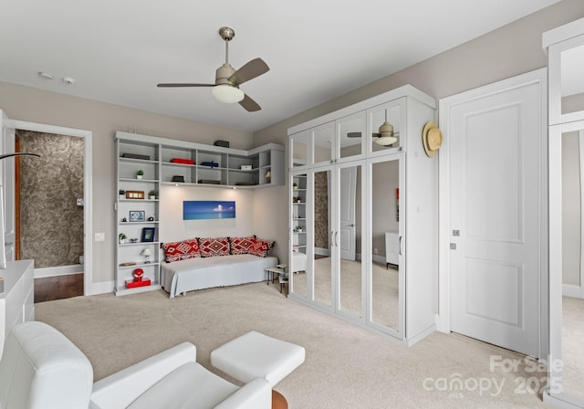 767 Pinnacle Dr, Iron Station, NC 28080 - carpeted living room featuring baseboards and ceiling fan