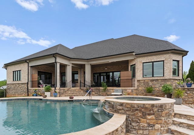 767 Pinnacle Dr, Iron Station, NC 28080 - rear view of property featuring brick siding, an in ground hot tub, stone siding, and an outdoor pool
