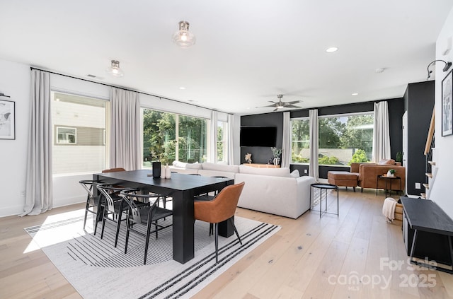 dining area with recessed lighting, ceiling fan, stairs, and light wood-style flooring