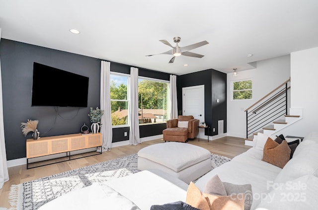 living room with stairs, wood finished floors, baseboards, recessed lighting, and a ceiling fan