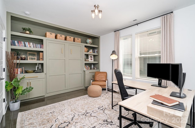 office space featuring built in shelves