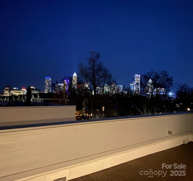 view of community featuring a view of city lights