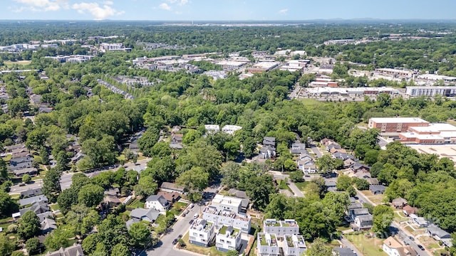 drone / aerial view with a view of trees and a residential view