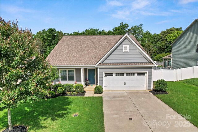 2124 Katie Alice Cir, Waxhaw, NC 28173 - traditional-style home featuring concrete driveway, a garage, and roof with shingles