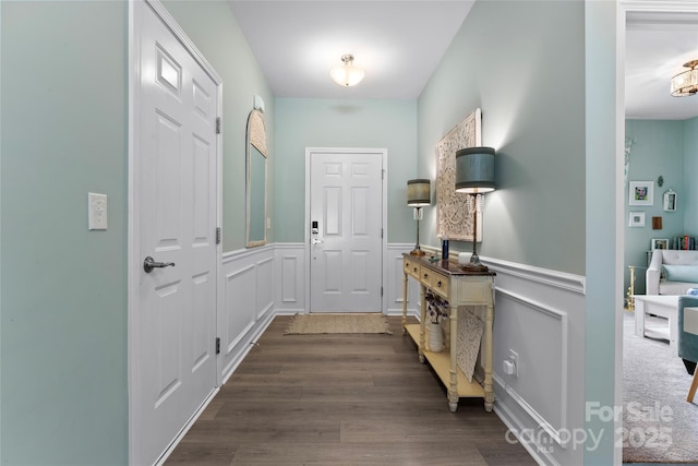 2124 Katie Alice Cir, Waxhaw, NC 28173 - entryway featuring dark wood-style flooring, a wainscoted wall, and a decorative wall