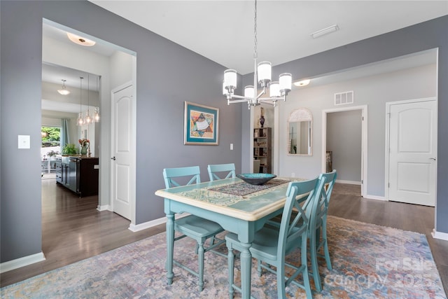2124 Katie Alice Cir, Waxhaw, NC 28173 - dining area featuring a chandelier, wood finished floors, and baseboards