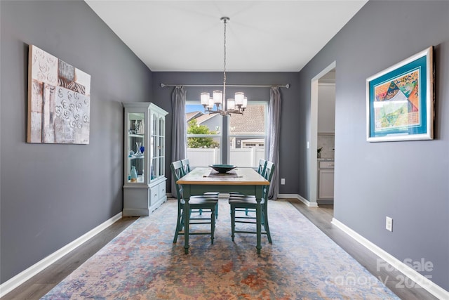 2124 Katie Alice Cir, Waxhaw, NC 28173 - dining room featuring a chandelier, wood finished floors, and baseboards