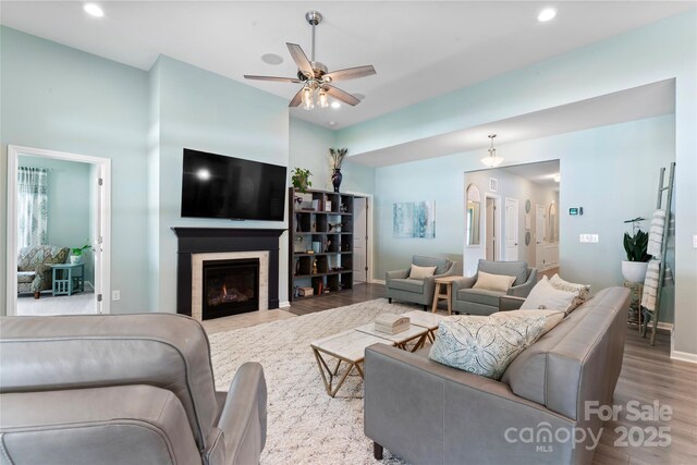 2124 Katie Alice Cir, Waxhaw, NC 28173 - living area featuring wood finished floors, a ceiling fan, recessed lighting, and a fireplace with flush hearth