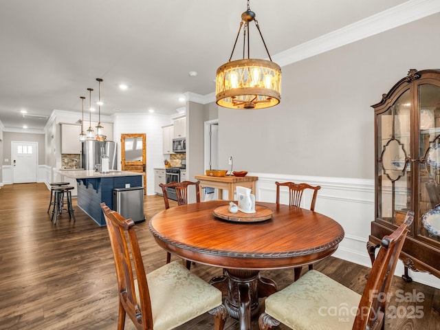 775 Summerfield Pl, Flat Rock, NC 28731 - dining room with wainscoting, recessed lighting, dark wood-type flooring, and crown molding