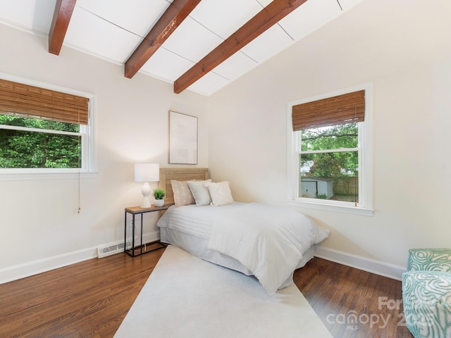 bedroom featuring baseboards, wood finished floors, multiple windows, and vaulted ceiling with beams