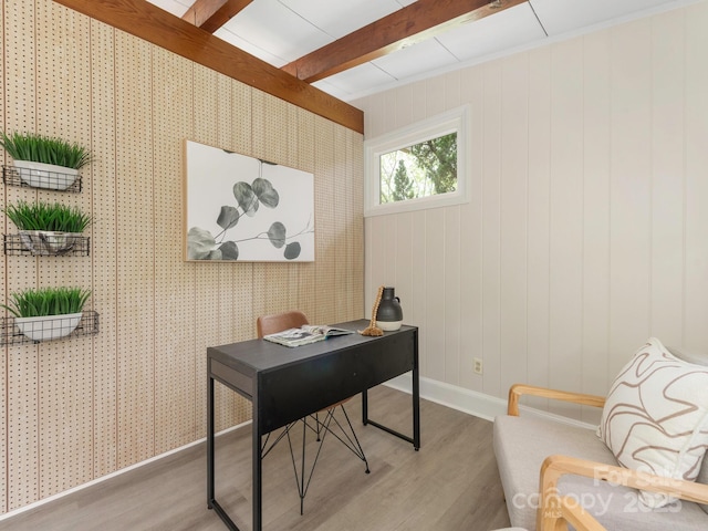 office featuring baseboards, beam ceiling, and light wood-type flooring