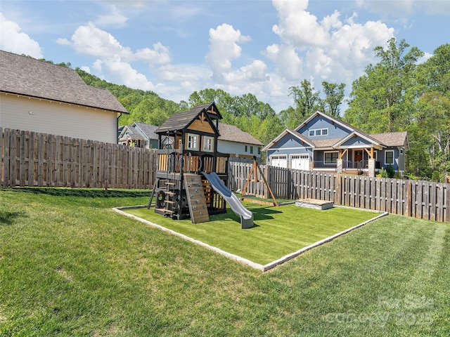 view of jungle gym with a lawn and a fenced backyard